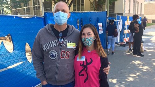 Shane and Hannah Doby outside Atlanta's Grady Memorial Hospital, where Shane is being treated after being shot in the face during a road rage incident. Photo by Bill Torpy