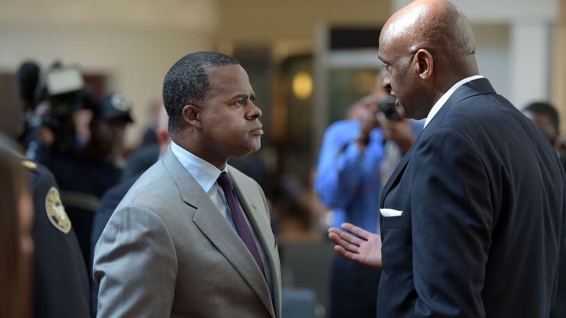 Miguel Southwell (right) talks with Atlanta Mayor Kasim Reed in friendlier times. Kent D. Johnson, kdjohnson@ajc.com