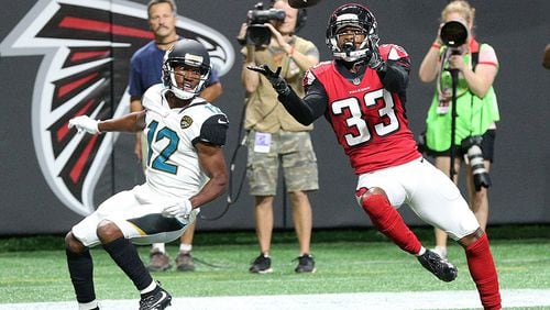 Falcons cornerback Blidi Wreh-Wilson intercepts the ball in front of Jaguars wide receiver Dede Westbrook in the endzone during the first quarter in a NFL preseason football game on Thursday, Aug. 31, 2017, in Atlanta.