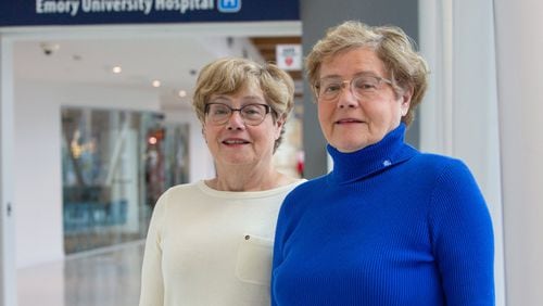 Identical twin sisters Fania Szlam (left) and Dora Richter were recently recognized by the Georgia Hospital Association for their longtime dedication and service to healthcare. They’ve both worked at Emory Healthcare/Emory University for more than 40 years, and have won many awards during this time. (Photo by Phil Skinner)