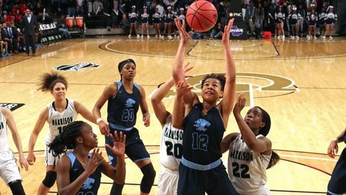 Lovejoy forward J'Aunna Robinson (12) grabs a rebound during the second half against Harrison of the GHSA Class AAAAAA Girls State Championship at McCamish Pavilion Friday, March 9, 2018, in Atlanta. Lovejoy won 57-41.