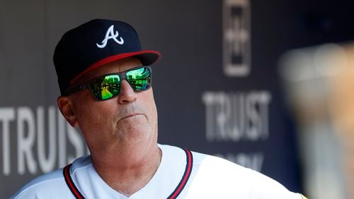 Braves manager Brian Snitker looks at the field from the dugout moments before the game against the San Francisco Giants at Truist Park on Sunday, August 20, 2023, in Atlanta. Miguel Martinez / miguel.martinezjimenez@ajc.com 