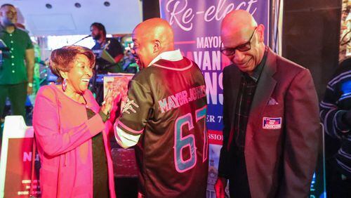 Savannah Mayor Van Johnson wears a jersey with "Mayor Johnson" printed across the back as he celebrates his re-election with former Mayors Edna Jackson and Otis Johnson on Tuesday, November 7, 2023 at Odyssey Lounge on Fairmont Avenue in Savannah.
