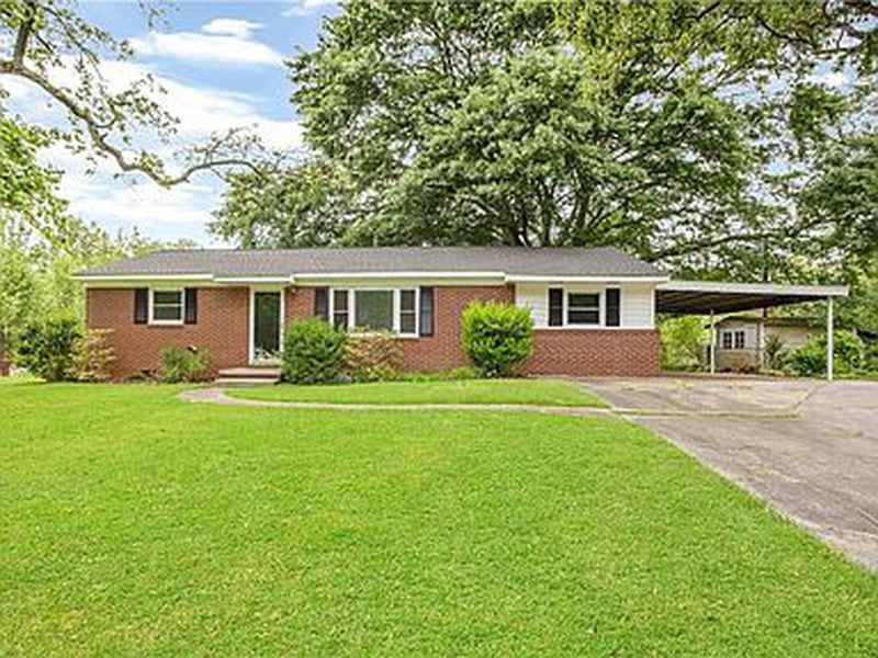 The spacious, fenced-in yard makes this home ideal for pet owners.