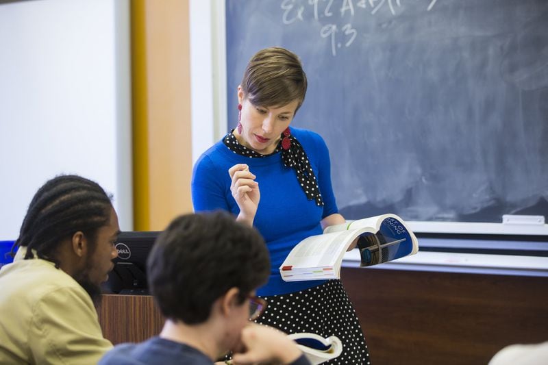 Erin C. Tarver, an assistant professor of philosophy, confers with her students at Oxford College of Emory University. Tarver is author of “The I in Team: Sports Fandom and the Reproduction of Identity.” Contributed