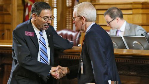 Rep. Mike Cheokas (left), R - Americus, Vice-Chairman of the Higher Education Subcommittee, speaks with Tom Daniel, Sr. Vice Chancellor, External Affairs with the University System of Georgia, who is retiring after more than 40 years with state government. BOB ANDRES / BANDRES@AJC.COM