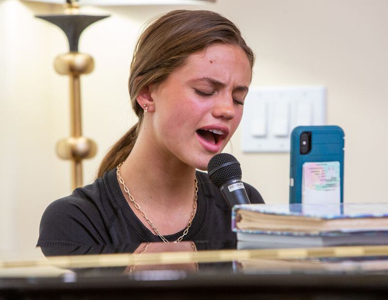 Kate Lauterbach sings for residents at Sanford Estates in Roswell. The Marist student has a passion for singing and is channeling it into a day-brightener for seniors. PHIL SKINNER FOR THE ATLANTA JOURNAL-CONSTITUTION.