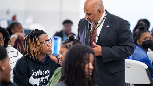 Hartsfield-Jackson International Airport general manager Balram Bheodari speaks with a student. The airport is kicking off its summer youth programs.