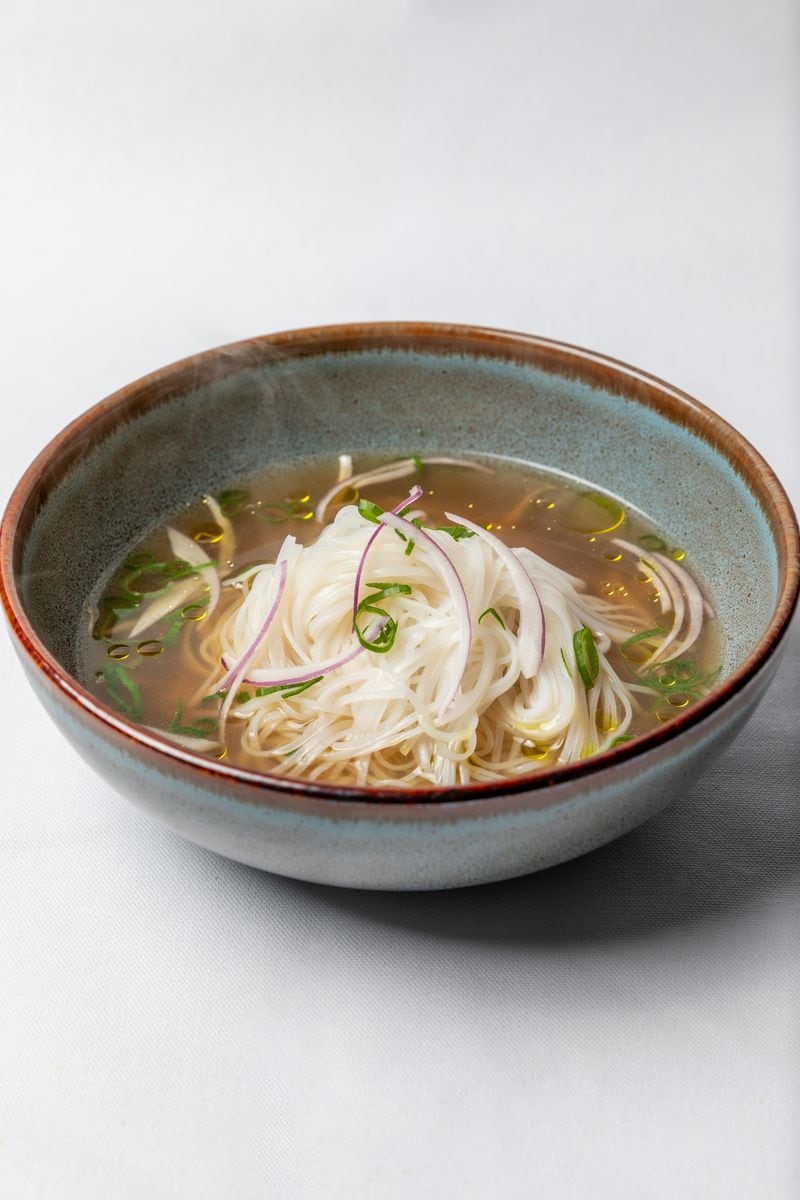 Juniper Cafe's pho includes oxtail broth, beef slices, and rice noodles.  The restaurant also offers a vegan version of this Vietnamese soup.  Courtesy of Eric Sun