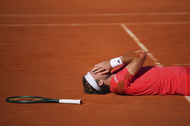 Stefanos Tsitsipas of Greece reacts after winning the 2nd set against Casper Ruud of Norway to win the Monte Carlo Tennis Masters final match 6-1, 6-4 in Monaco, Sunday, April 14, 2024. (AP Photo/Daniel Cole)