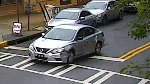 Police are on the lookout for a white or silver Nissan Altima with damage to the front right fender and bumper.