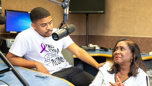 Silas Alexander and Sandra Alexander, the son and wife of late radio personality SiMan, are seen in the studio at 1380 WAOK in Midtown on Monday, Aug. 15, 2022. (Jenni Girtman for The Atlanta Journal-Constitution)