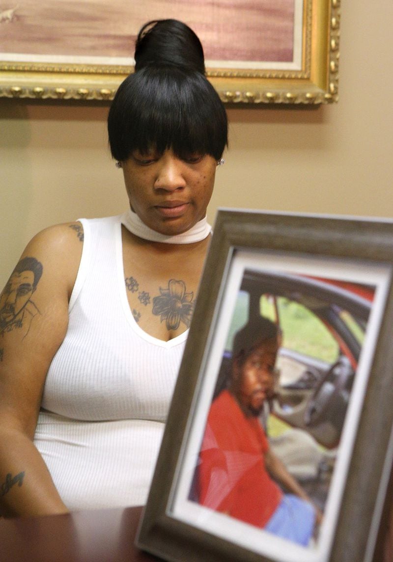 After her brother Jessie Taylor III died, Belinda Taylor had his portrait tattooed on her right arm. The Taylor family is suing LogistiCare and the transport company involved, Vidalia-based Relicare. CURTIS COMPTON / CCOMPTON@AJC.COM