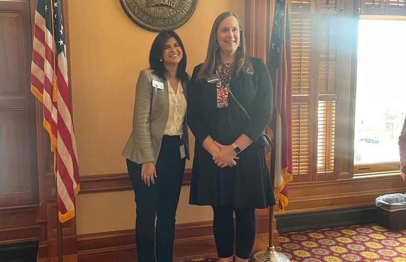 The Rev. Andi Woodworth (right) poses with State Rep. Saira Draper, D-Atlanta, after offering the opening devotion before the Georgia House of Representatives on Monday.