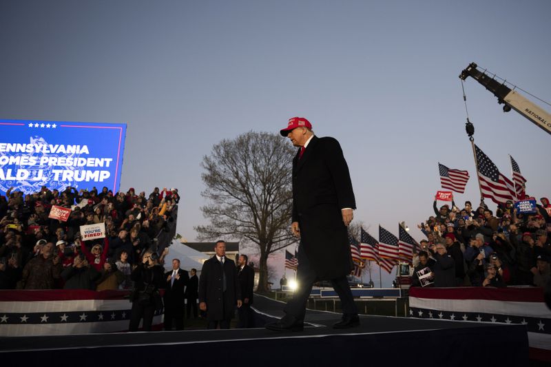 Former U.S. President Donald Trump walks to the podium during a campaign event in Schnecksville, Pa., on Saturday, April 13, 2024. (AP Photo/Joe Lamberti)