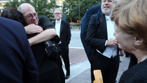 Atlanta Symphony Orchestra Music Director Robert Spano hugged and greeted musicians at a protest on what would have been opening night, Sept. 25. BEN GRAY / BGRAY@AJC.COM