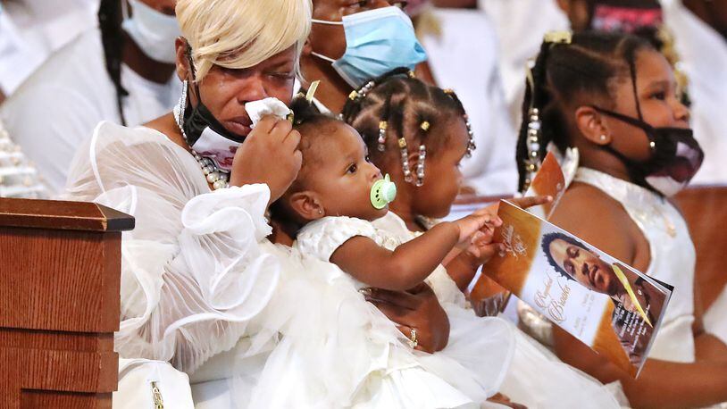 Tomika Miller, the wife of Rayshard Brooks, weeps while holding their 1-year-old daughter Dream during his funeral in Ebenezer Baptist Church on Tuesday, June 23, 2020 in Atlanta. Brooks, 27, died June 12 after being shot by an officer in a Wendy's parking lot. Brooks' death sparked protests in Atlanta and around the country.  Curtis Compton ccompton@ajc.com
