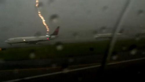 A freeze frame shows the moment lightning struck a Delta Air Lines plane in Atlanta on Tues., Aug. 18, 2015. (Credit: YouTube)