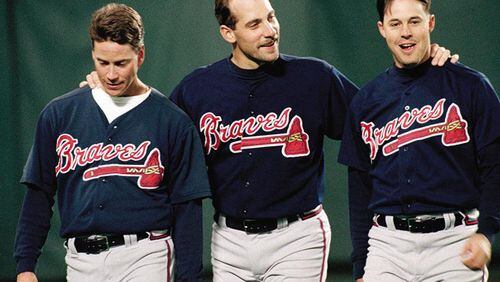 Tom Glavine (left) and Greg Maddux (right) were among the core of Atlanta's championship pitching staff that also included John Smoltz (center).