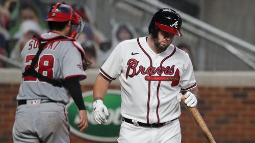 Braves Matt Adams strikes out with the bases loaded to end the 7th inning against the Washington Nationals Monday, Aug. 17, 2020 in Atlanta.