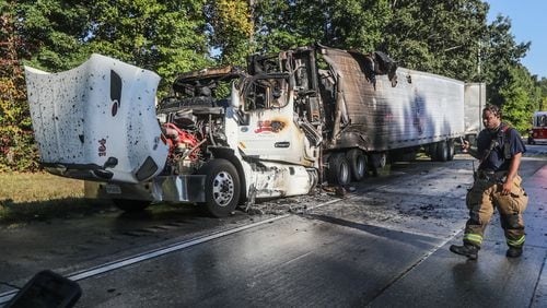 A tractor-trailer hauling dog food and bound for Florida caught on fire Wednesday morning along I-285 South near Langford Parkway, resulting in hours of delays.