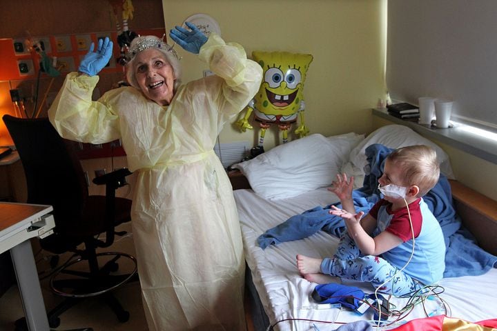 Staff photographer Curtis Compton captures the magic of 91-year-old Jackie Viener as she brings hope, joy and secret wishes to hospitalized children.