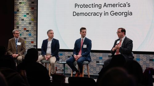 Atlanta Journal-Constitution government reporter Mark Niesse (far left) moderates a discussion with Georgia Republican Party Chairman Josh McKoon and Democratic Party of Georgia First Vice Chair Matthew Wilson about campaigns and cybersecurity at a summit Google hosted Tuesday. (Natrice Miller/ Natrice.miller@ajc.com)