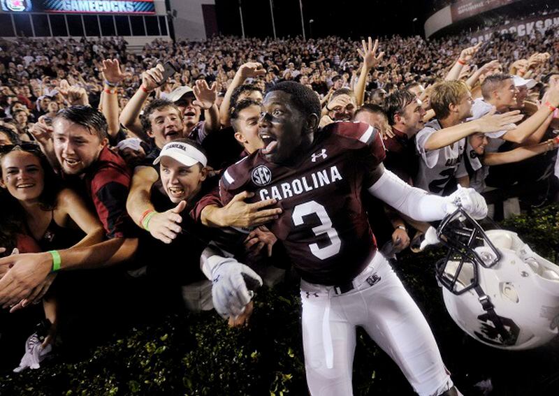 South Carolina cornerback Chris Lammons (3) celebrates with fans in the student section after South Carolina defeated Georgia 38-35 during an NCAA college football game Saturday, Sept. 13, 2014, in Columbia, S.C. (AP Photo/Rainier Ehrhardt) A scene Georgia fans are sick of seeing. (Rainier Erhardt/AP)