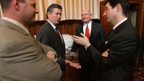 John Walker, right, talks with then-Gov. Sonny Perdue, then-House Speaker Glenn Richardson and Jay Walker in 2006. (BEN GRAY/AJC staff)