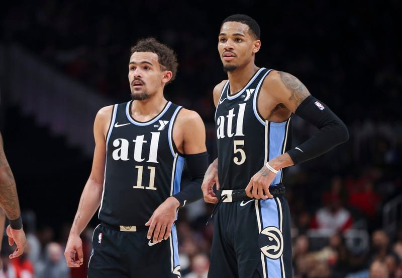 Hawks guards Trae Young (left) and Dejounte Murray.