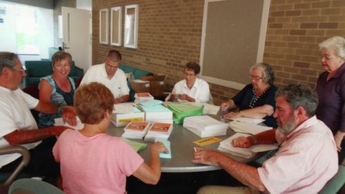 Lifelong Learning Institute volunteers work on numerous committees and tasks, such as mailing course catalogs and event information to members. (Handout/Lifelong Learning Institute)