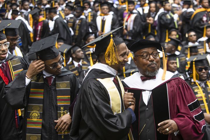 A Morehouse College faculty member prepares graduates to go on stage during the Morehouse College commencement ceremony on Sunday, May 21, 2023, on Century Campus in Atlanta. The graduation marked Morehouse College's 139th commencement program. CHRISTINA MATACOTTA FOR THE ATLANTA JOURNAL-CONSTITUTION