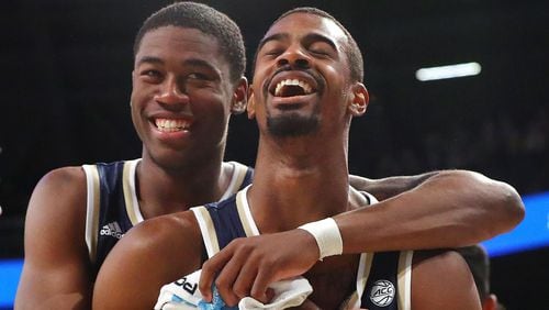 Georgia Tech forward Moses Wright (left) gives guard Curtis Haywood II a hug Sunday, March 3, 2019, during game against Boston College in Atlanta.