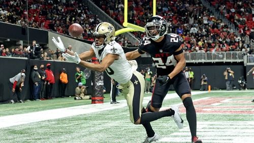 Jan. 9, 2022 - Atlanta, Ga: Atlanta Falcons cornerback A.J. Terrell (24) breaks up a pass intended for New Orleans Saints wide receiver Tre'Quan Smith (10) during the second half at Mercedes-Benz Stadium, Sunday, January 9, 2022, in Atlanta. The Falcons lost to the Saints 30-20. JASON GETZ FOR THE ATLANTA JOURNAL-CONSTITUTION



