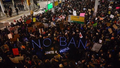 NEW YORK, NY - JANUARY 28: Protestors rally  during a demonstration against the Muslim immigration ban at John F. Kennedy International Airport on January 28, 2017 in New York City. President Trump signed the controversial executive order that halted refugees and residents from predominantly Muslim countries from entering the United States. (Photo by Stephanie Keith/Getty Images)