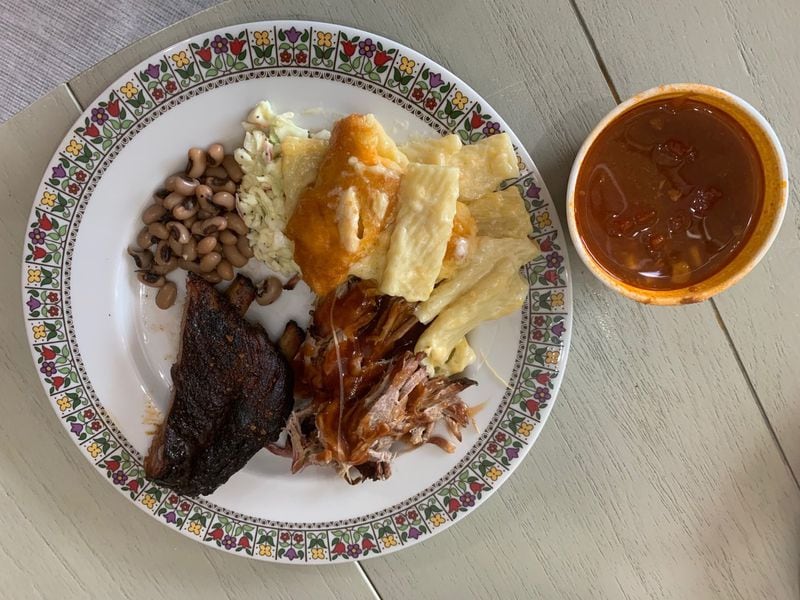 Among the Community Q fare enjoyed by the King family are pulled pork, ribs, mac and cheese, coleslaw and black-eyed peas, with a side of Brunswick stew. CONTRIBUTED BY OLIVIA KING