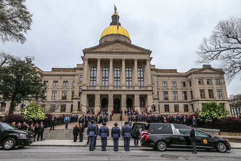 The casket of Zell Miller arrived at the State Capitol on Tuesday after a service at Peachtree Road United Methodist Church. He will lie in state until an executive state funeral on Wednesday. JOHN SPINK / JSPINK@AJC.COM