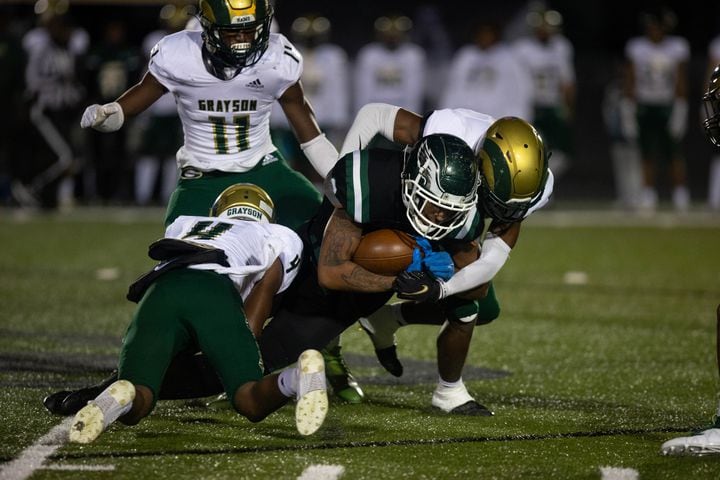 Collins Hill's Ethan Davis (9) is tackled during a GHSA high school football game between the Collins Hill Eagles and the Grayson Rams at Collins Hill High in Suwanee, GA., on Friday, December 3, 2021. (Photo/ Jenn Finch)