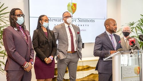 The family of Imani Bell files a lawsuit against Clayton County educators at Elite Scholars Academy in the death of the 16-year-old student who died during basketball practice in Aug 2019 during extreme heat and humidity.  The Stewart Miller Simmons Trial Attorneys held the press conference with Imani's parents, Eric and Dorian Bell, from left, Attorneys Justin Miller and L. Chris Stewart on Wednesday, Feb 24, 2021 and cited a heat index as high as 106 degrees on the day of her death, when coaches directed Imani to run stadium steps, despite signs of heat illness.  She collapsed near the top of the steps and died of heatstroke.  (Jenni Girtman for The Atlanta Journal-Constitution)
