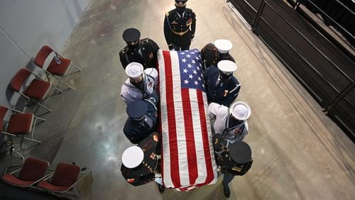 July 25, 2020 Troy - The casket of  Congressman Lewis is brought out by joint honor guards after a service celebrating "The Boy from Troy" at Trojan Arena in Troy University on Saturday, July 25, 2020. (Hyosub Shin / Hyosub.Shin@ajc.com)