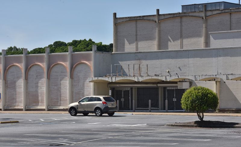 North DeKalb Mall, which sits about half-empty, has gained additional revenue as a site for film productions, turning vacant storefronts into fictional sets. HYOSUB SHIN / HSHIN@AJC.COM