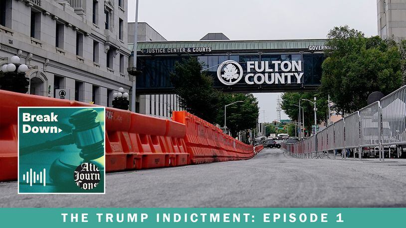 Barricades are erected in front of the Fulton County courthouse, in anticipation of possible indictments in the investigation into whether former President Donald Trump and his allies meddled in the 2020 election in Georgia. The case is the subject the AJC's "Breakdown" podcast, now beginning its tenth season. (Brynn Anderson / AP)