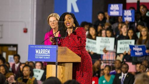 U.S. Rep. Ayanna Pressley, D-Mass., tells a group of protestors to quiet down after they erupted in chants at the start of Elizabeth Warren's speech during her campaign stop at Clark Atlanta University in Atlanta, Thursday, November 21, 2019. (Alyssa Pointer/Atlanta Journal Constitution)