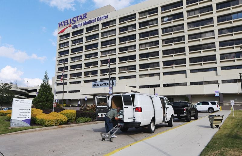 A man loads equipment into his van outside of the Atlanta Medical Center on Monday, October 31, 2022, in Atlanta.  The medical center closed the next day. (Christina Matacotta for the AJC)