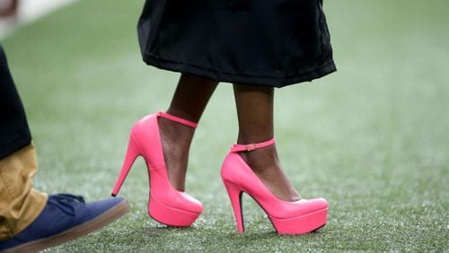 Fayette County wants to protect its turf fields from punctures caused by sharp heels. AJC file photo
