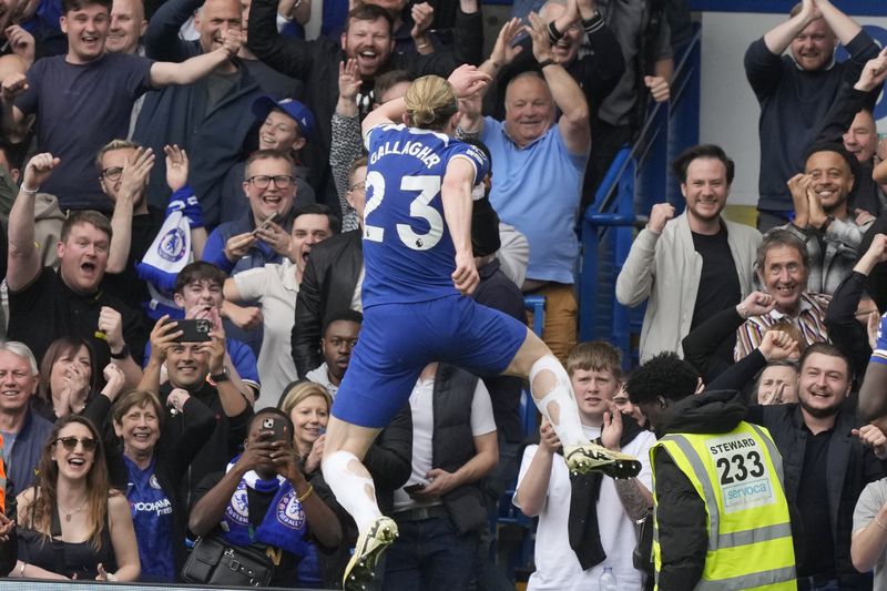 Chelsea's Conor Gallagher celebrates after scoring his side's second goal during the English Premier League soccer match between Chelsea and West Ham United at Stamford Bridge stadium in London, England, Sunday, May 5, 2024. (AP Photo/Frank Augstein)