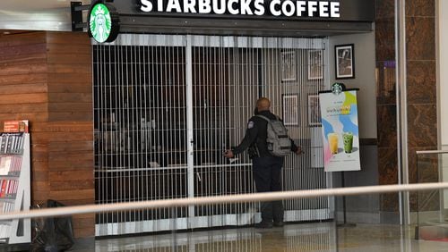 Starbucks is closed at arrival area of Maynard H. Jackson Jr. International Terminal on Saturday, March 14, 2020. (Hyosub Shin / Hyosub.Shin@ajc.com)