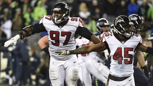 Falcons defensive tackle Grady Jarrett (97) and middle linebacker Deion Jones (45) react after the Seattle Seahawks missed a long field goal attempt in the last minute of the fourth quarter at CenturyLink Field on Nov. 20, 2017 in Seattle.