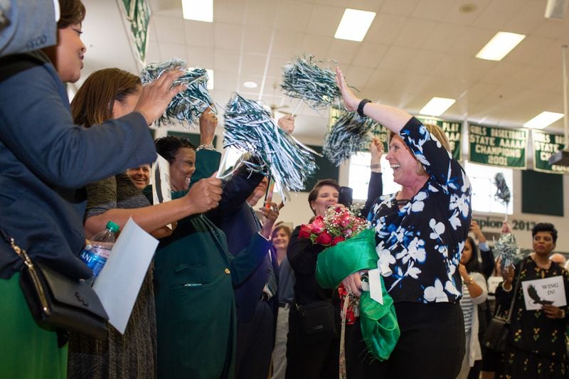 Collins Hill High School Principal Keresna Wing walks into the lobby to a celebration by students and faculty on Monday, Oct. 21, 2019, in Suwanee, Georgia. Wing was awarded National Principal of the Year by the National Association of Secondary School Principals. (Photo/Rebecca Wright for the Atlanta Journal-Constitution)