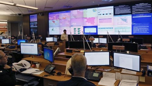 Most of the personnel in the CDC’s Emergency Operations Center in Atlanta is dedicated to fighting the Ebola outbreak in West Africa. Several giant screens face the room, filled with maps and charts that track the progress of the effort. BOB ANDRES / BANDRES@AJC.COM